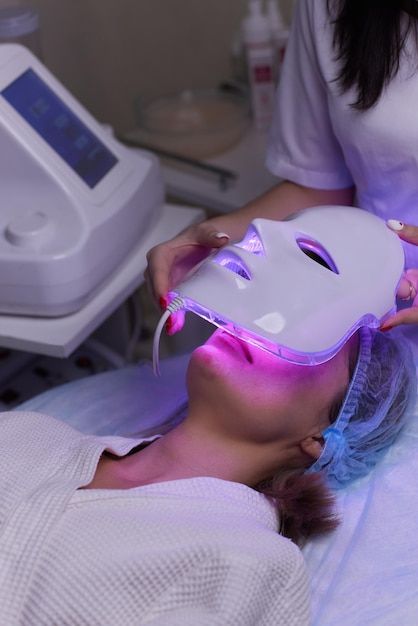 Woman receiving LED Light Therapy facial treatment
